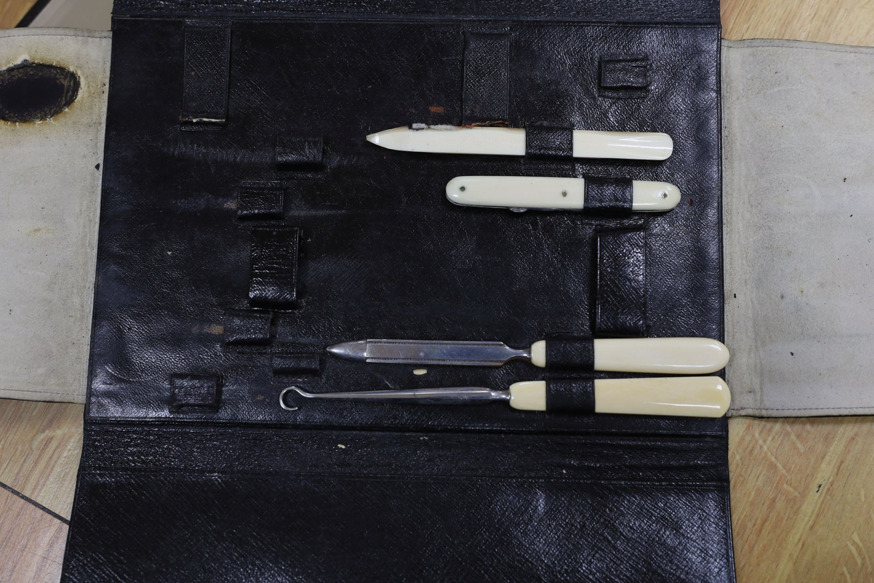 A Dupont travel suitcase, initialled ‘L.C.’ with French white metal mounted bottles